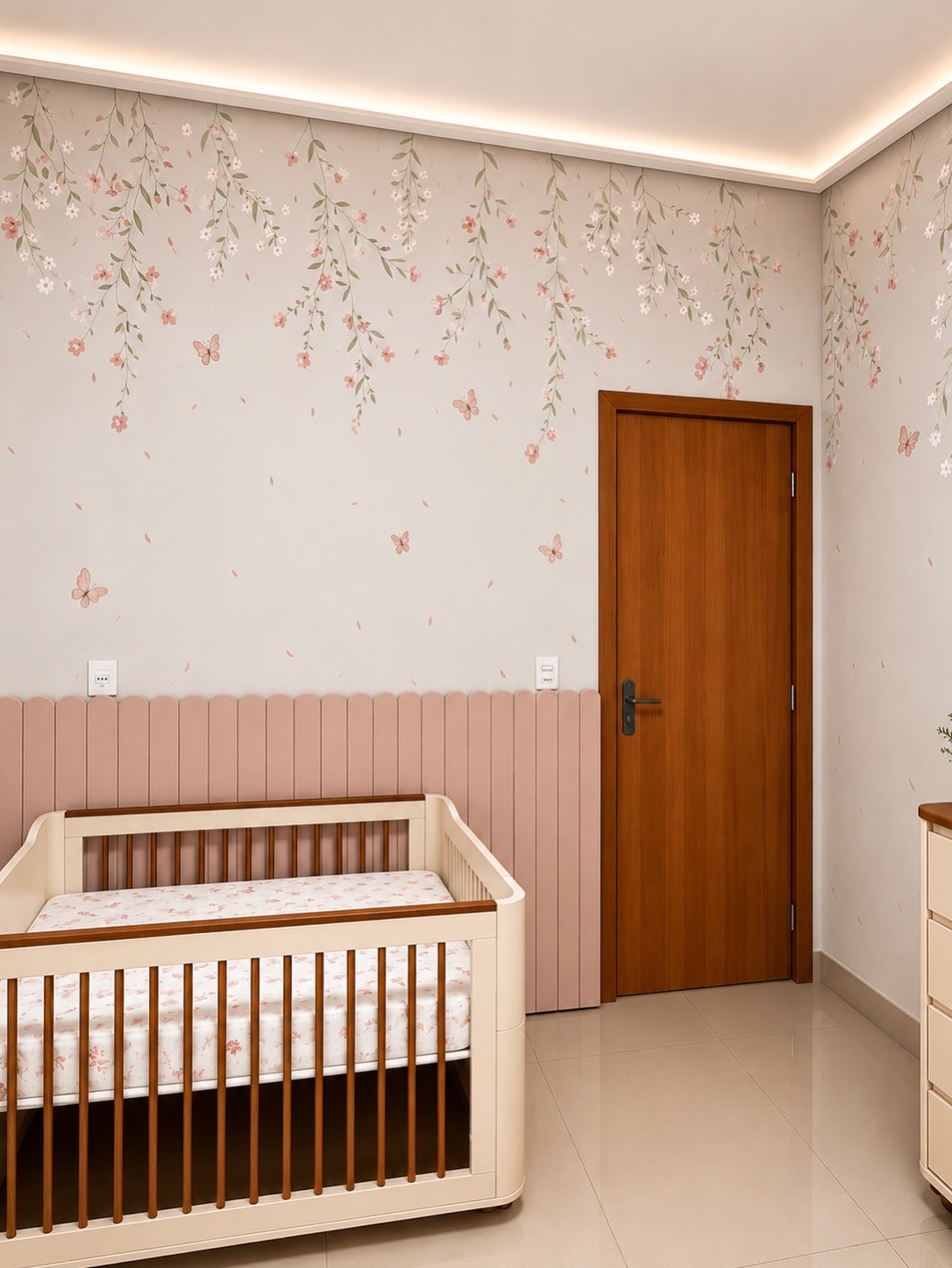 Quarto com berço, meia parede rosa e folhagens com borboletas pintadas no alto